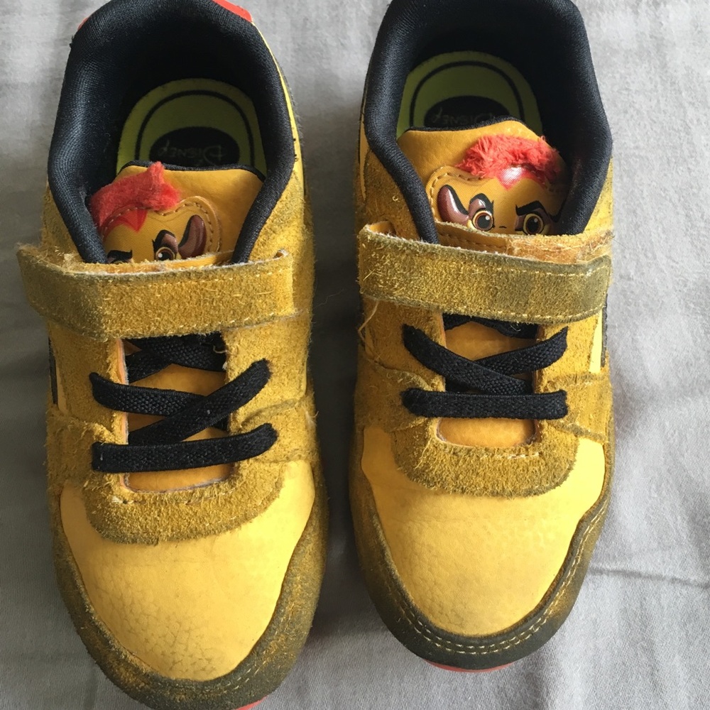 Boys Reebok special addition lion king sneakers.